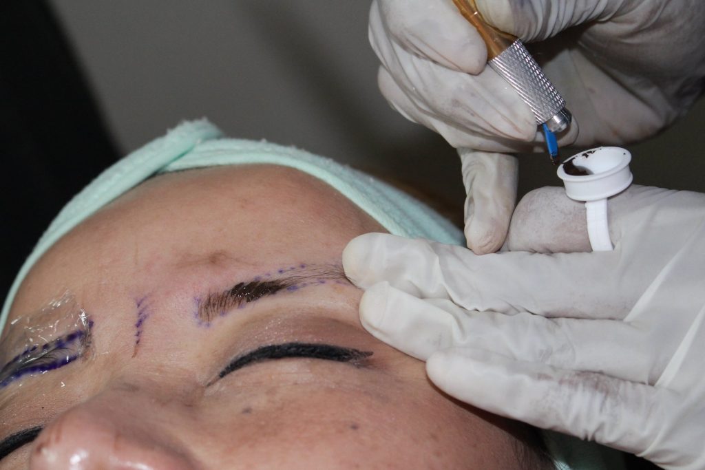 Microblading eyebrow procedure in progress at K's iBrows & Lashes Studio, Aubrey TX