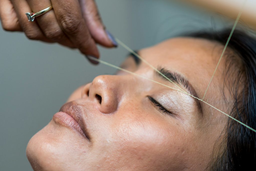 Eyebrow threading close-up